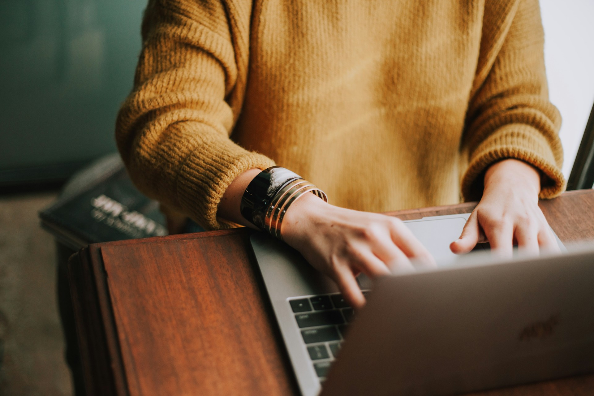 Person typing at a laptop